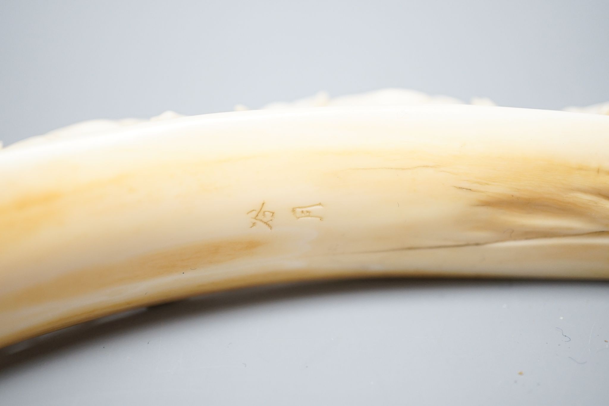 A hippopotamus tusk carving, two character mark, 25cm